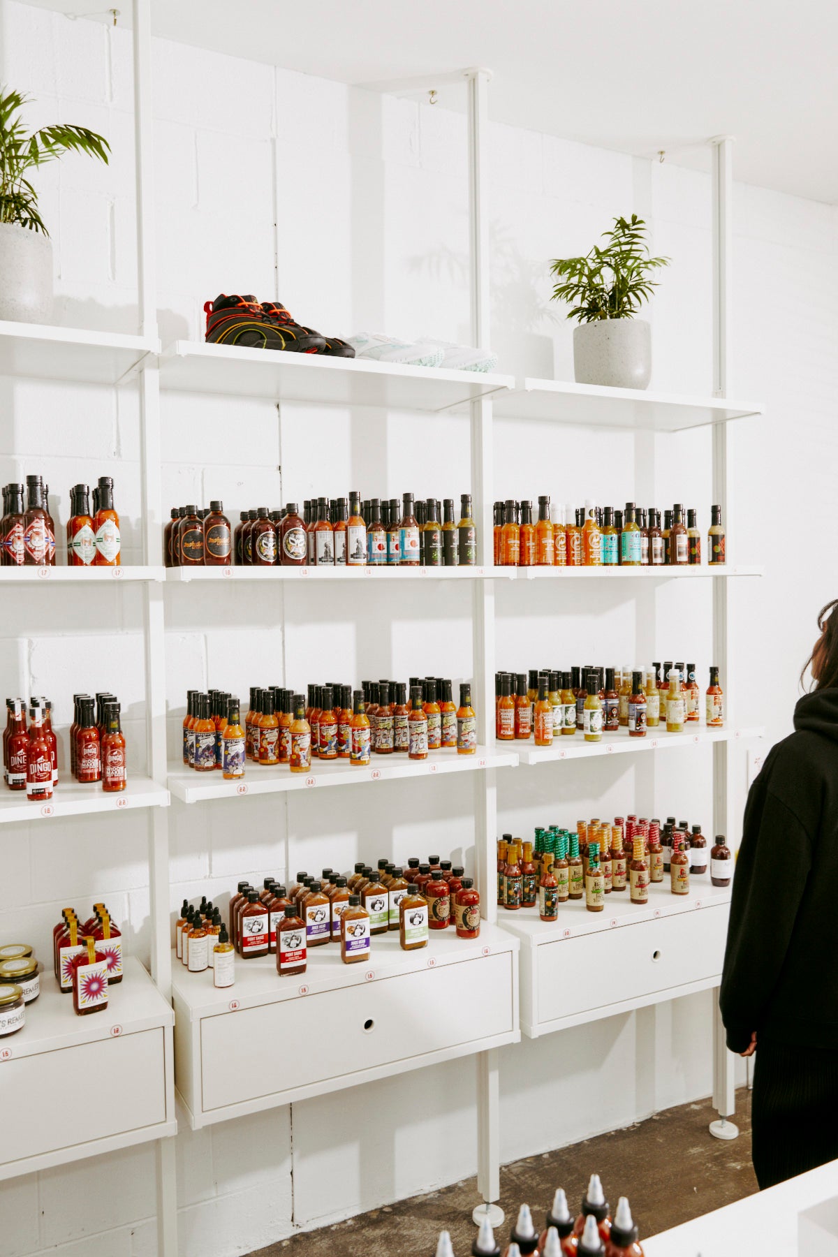 Hot Sauce on shelves in a clean white room