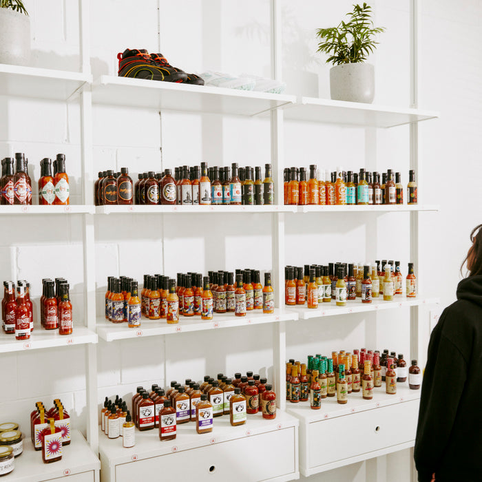 Hot Sauce on shelves in a clean white room