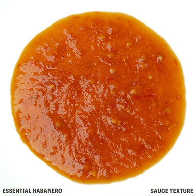 A top-down circular view of a thick, glossy orange-red habanero sauce texture on a white background, with text reading 'ESSENTIAL HABANERO' and 'SAUCE TEXTURE' at the bottom.