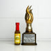 Hot sauce bottle with a trophy on a white background